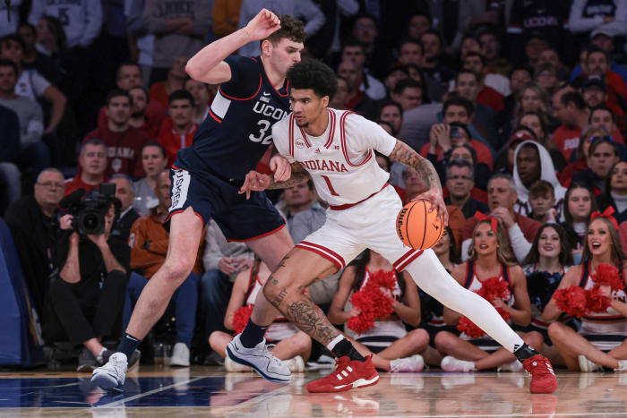 Indiana Hoosiers center Kel'el Ware (1) dribbles against Connecticut Huskies center Donovan Clingan (32) during the first half at Madison Square Garden.